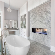Luxurious Master Bathroom in New Home with Fireplace and Large B